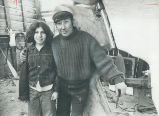 Happy Smiles are worn by Norair Kassabian and his daughter, Nora, 11, at launching of 45-foot cement hull ketch they worked on together