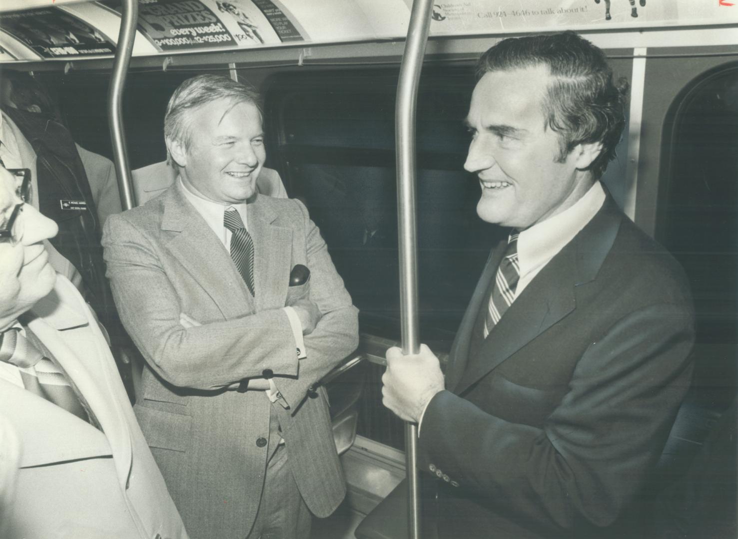 Strap-hanging VIPs: William Davis escorted Massachusetts Governor Edward King on a tour of Toronto's subway system yesterday