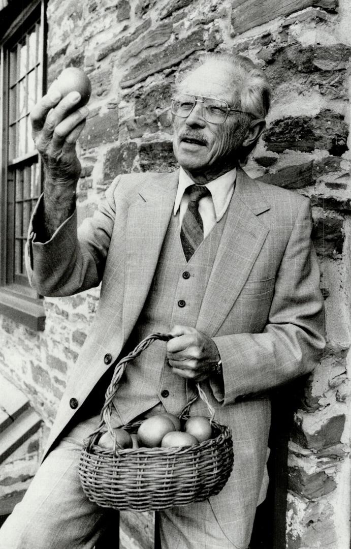 Apple expert: Aleck Hutchinson holds up a Rhode Island Greening apple at Montgomery's Inn