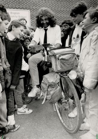 Tales of travel: Bernie Howgate, the Etobicoke electrical engineer who spent eight years touring the world on his bike, enthrals students at John English School