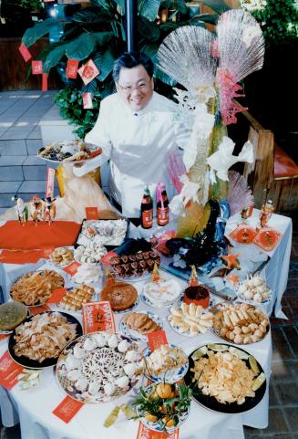 Year of the rooster: An elaborate sugar sculpture reigns over a table of festive hors d'oeuvres created by Frank Hsu and his team.