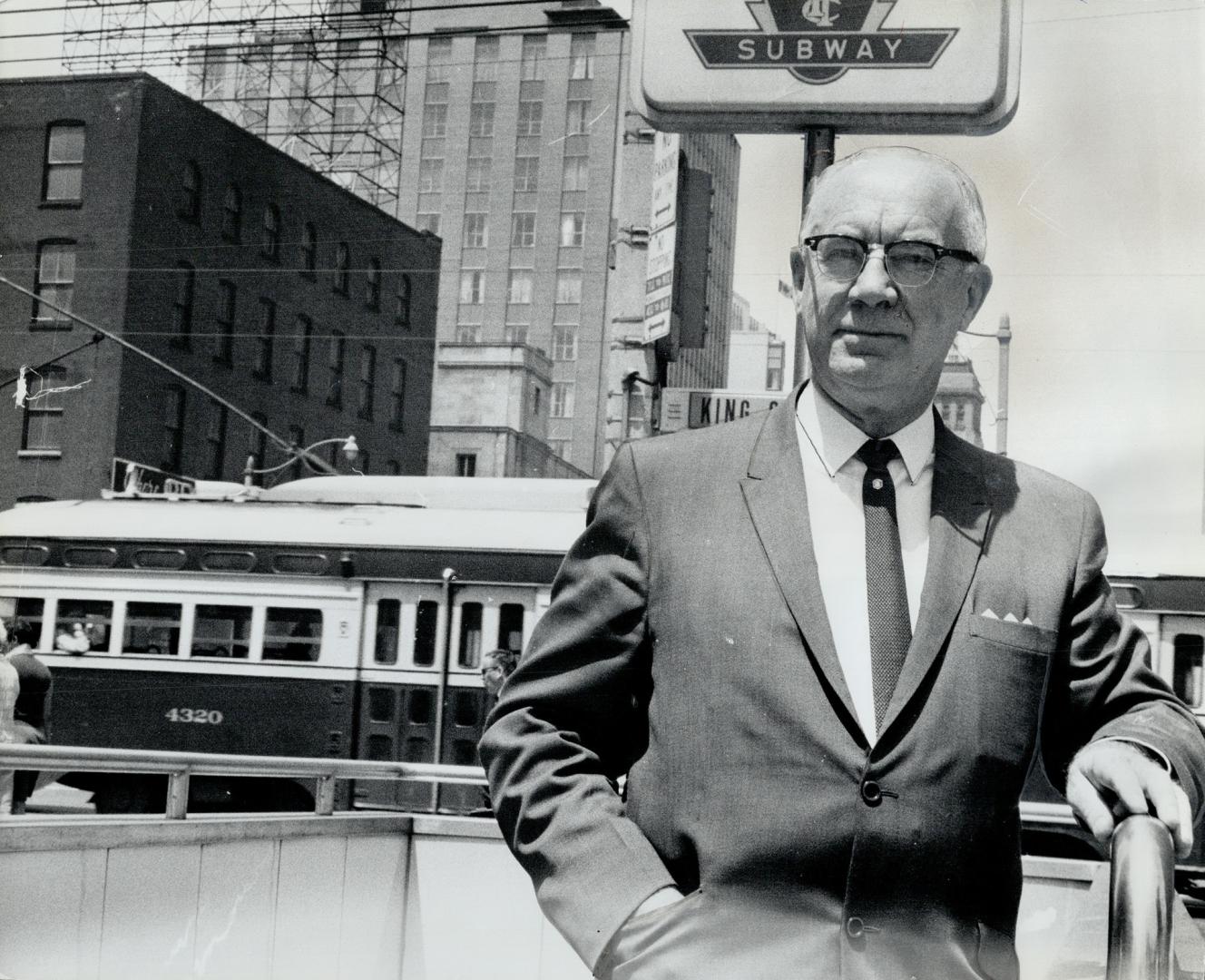 John Gordon Inglis, general manager of operations for TTC, stands in front of one of the streetcars he has made provide such good service that experts from many cities come to see how it's done