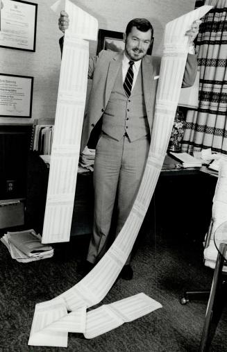 A better way: Lawyer Bill Jeffery, above, with a computer printout of a weekly mortgage amortizaiton schedule, wants all financial institutions to offer the payment option