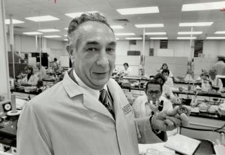 Canadian-built quality: Ronald Keating, president of LItton System Canada, holds one of the gyroscope the company producer