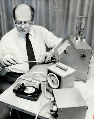 Toronto engineer William Kitchen uses a small ionization generator