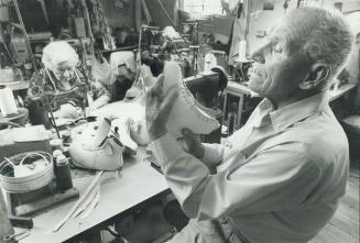 A master at work: John Knebli, 88, inspects one of the 100,000 pairs of skates he has made in his long and satisfying career