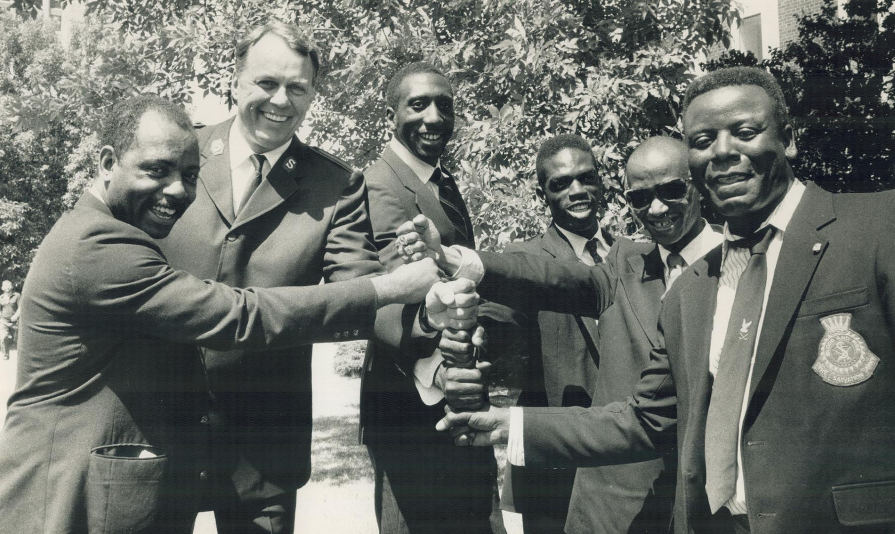 Wrote their ticket: Sven-Erik Ljungholm (second from left) stands with graduates of his New York city literacy program for the homeless