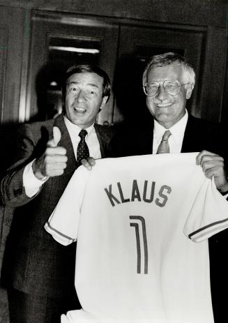 Number 1: Czech Prime Minister Vaclav Klaus, righ, is given a personalized Blue Jays shirts by Revenue Minister Otto Jelinek before a Toronto speech yesterday