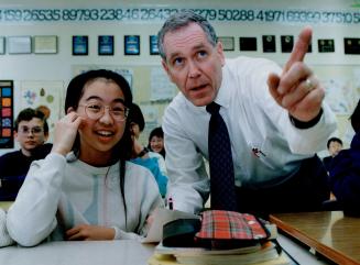 Winning format: Charles Ledger, whose Zion Heights school students regularly win national math tests, instructs Ingrid Goh.