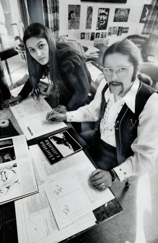 Cinema Canada editor and publisher George Koller, 27, and managing editor Agi Ibranyi-Kiss work on layout for their bimonthly publication