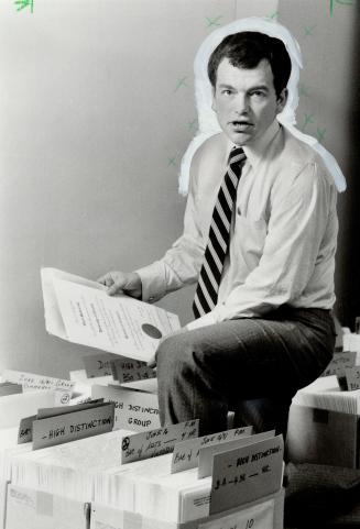 Diplomas in distress: Director of student records Lippard displays some of the certificates that aren't claimed.