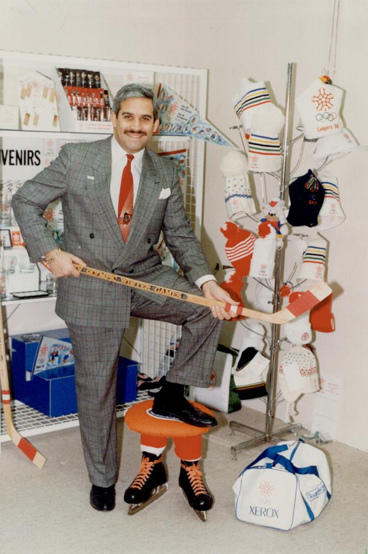 Surrounded by souvenirs: Art Kraus poses with some of the products handled by his company