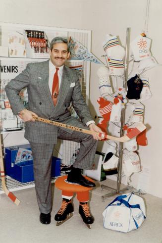 Surrounded by souvenirs: Art Kraus poses with some of the products handled by his company