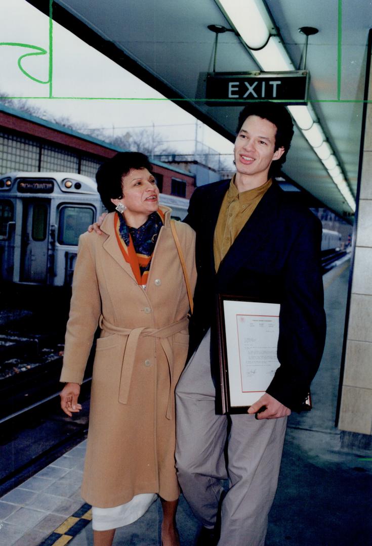 Bashful Steve Lopez faces the limelight at Davisville station yesterday under the admiring gaze of mother Eral Zong