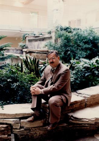 Seniors home: Dr. Janis Lusis, chairman, sits in the two-storey atrium of Kristus Darzs Home for the Aged being opened by the Latvian community on Pine Valley Drive, Woodbridge, on Saturday.