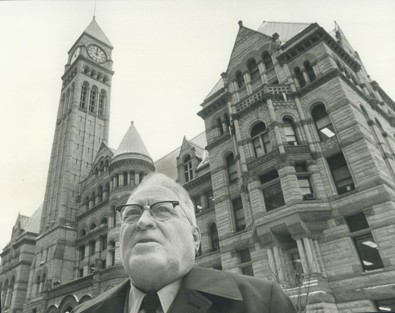 Joseph McDermott, a friend of th eold city hall, in front of the building he loves and wants to preserve