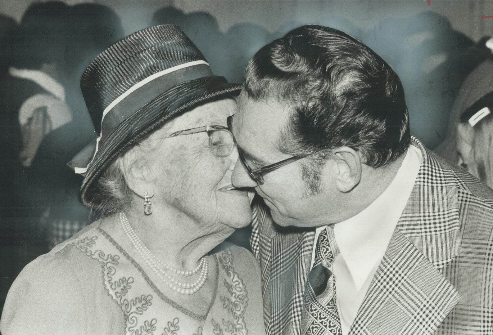 Kiss for a victor: Ellwood Madill, 57, gets a kiss from his mother after winning the riding of Peel-Dufferin-Simcoe for the Conservatives by more than 4,000 votes, dumping the new Liberal candidate, Ross Milne, who took over reins from 10-year veteran Bruce Beer