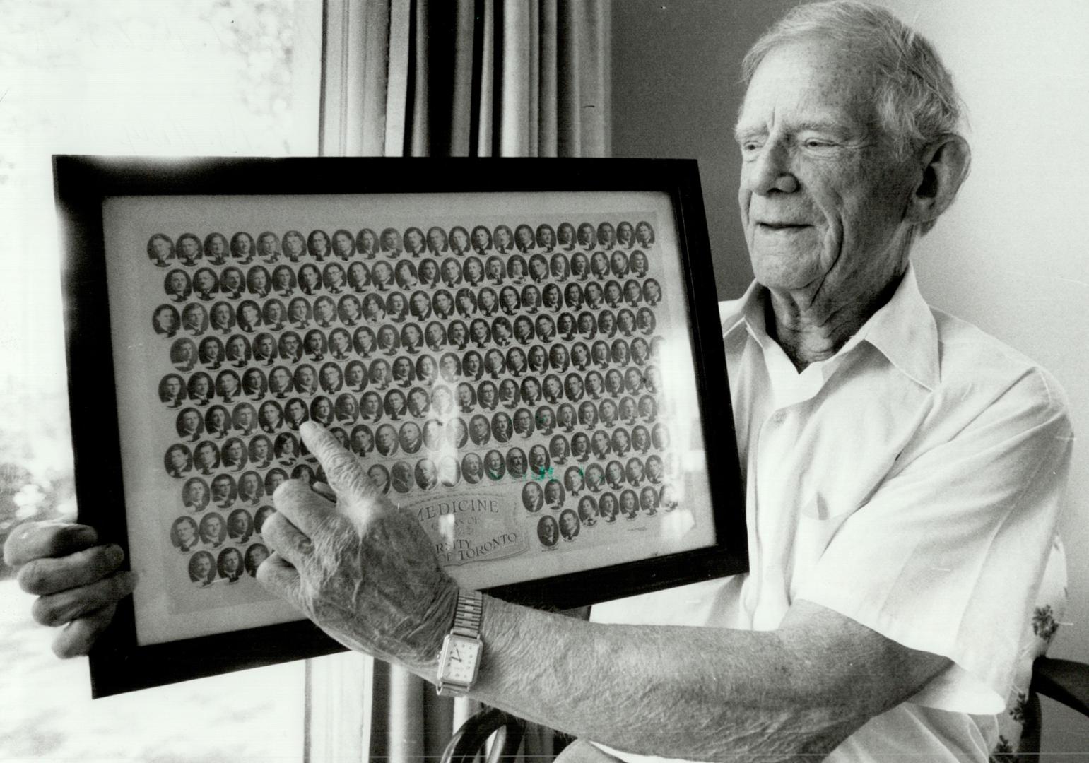 Time for reminiscing: Dr. Andy McGee, one of 191 graduates from the class of '26 at U of T's medical school, points to himself in the graduation photo. Twenty of the 42 survivors of the class will attend a 60-year reunion this week at the Toronto Hunt Club.