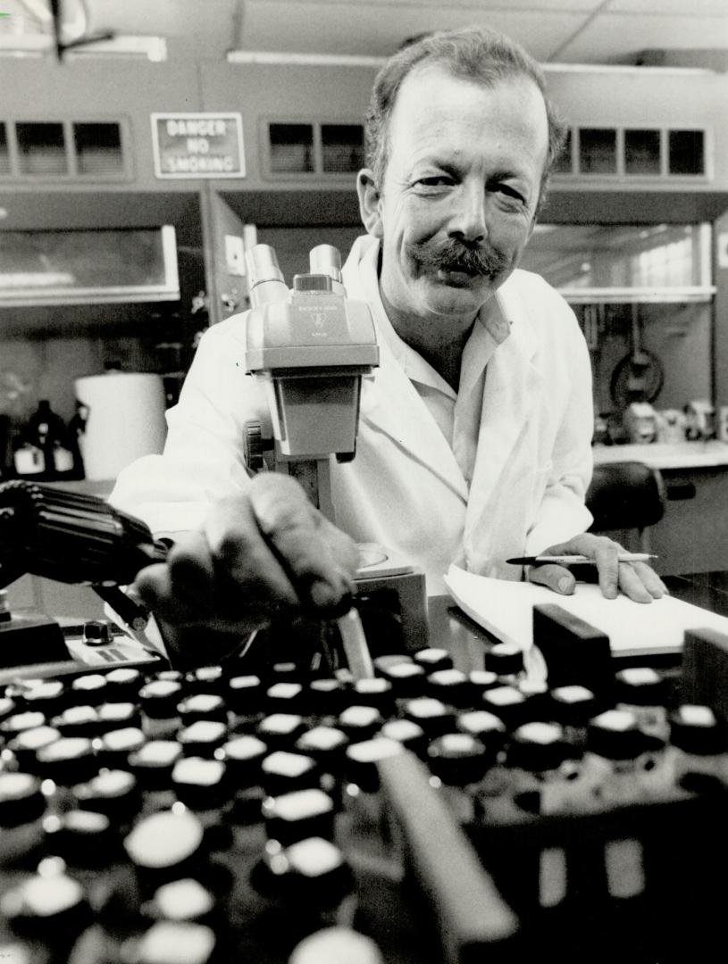 Research boss: Dr. Charles MacInnes, who is responsible for the $1.4 million spent annually on rabies research in Ontario, is seen in his laboratory at Maple. The province spends approximately $15 million a year for vaccines, treatments, research, diagnoses and rabies quarantines.