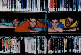 Serious readers: The McNamaras, from left, mother Irene, Andy, 11, Adam, 9, and father John, are Pickering Library's Family of the year.