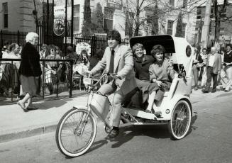 Tables turned: Student entrepreneur Leslie Marlowe takes Greg Guest and Anne-Marie Applin on a tour of Yorkville in a demonstration of his pedicab service which starts Tuesday