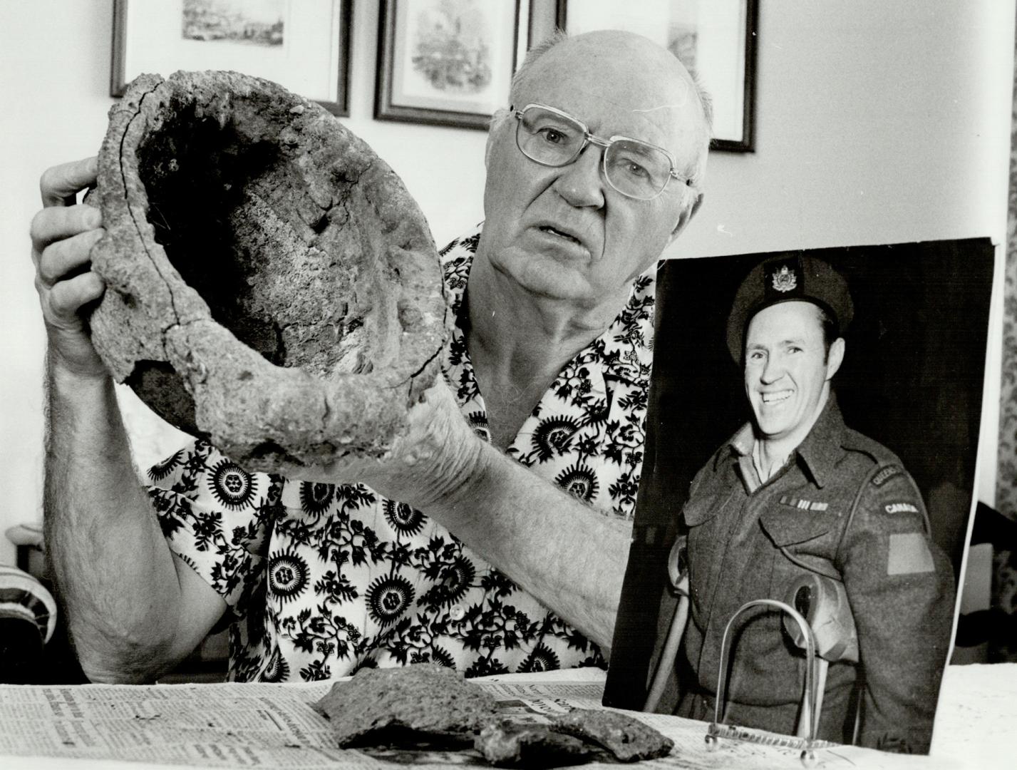 Charlie Martin: Mississauga man with Canadian tank helmet he found on beach when he revisited Normandy in 1953 and a picture of himself as a wounded soldier in 1945