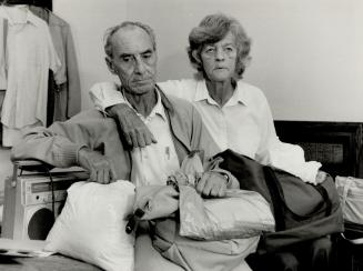 Flood victims: Jim Martin, 63, and wife Olive, 66, sit in an oshawa motel room with all that is left of their belongings