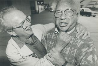 To Poland: Irving Milchberg, left, of Niagara Falls and Walter Cykiert of Detroit meet at Pearson Airport last night on their way to the 50th anniversary of the Warsaw Ghetto Uprising against the Nazis.