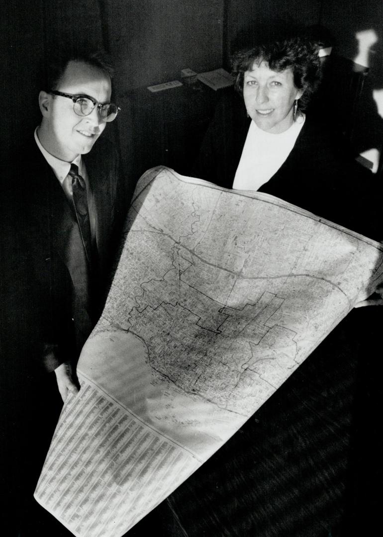 Development duo: Housexco executive director Michael Mellling and community development worker Sally Bryant scan a Metro map for housing areas.