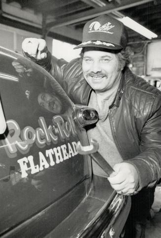 Long-time hobby: Harold Middleton, who has wielded wrench and torch to build many street rods, leans on his latest - a '47 Ford coupe, nicknamed Rock 'n' Roll Flathead