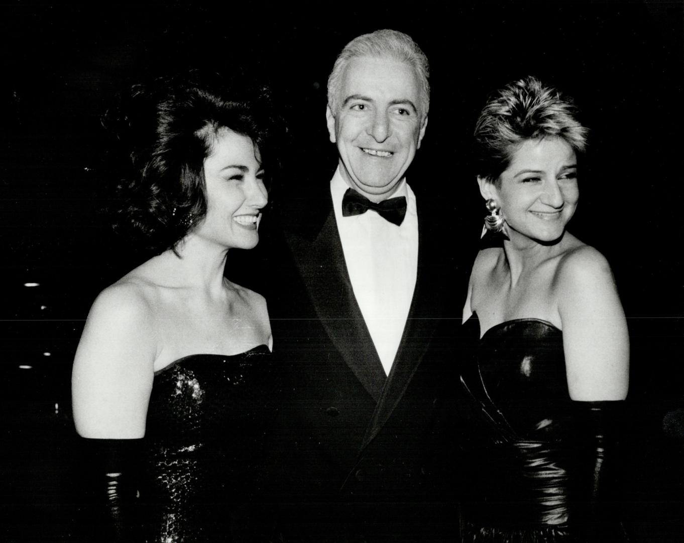 Right, Miller Group president Peter Miller, with bustiered beauties wife Mimi, left, and designer Mariola Mayer, who is represented by the Miller Group