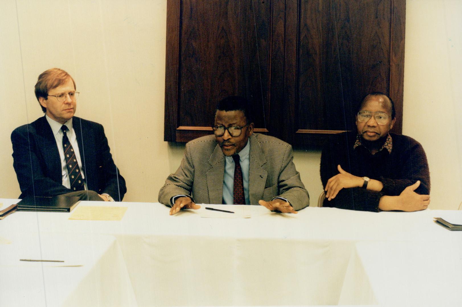 Billy Modise (centre) SA. High Commissioner to Canada Patrick Evans (l) 7 Jaba Dube (r) [Incomplete]