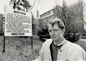 Coming down: Bill Morris, of the Federation of Metro Tenants Associations, stands beside apartment building at 10 Tichester Rd