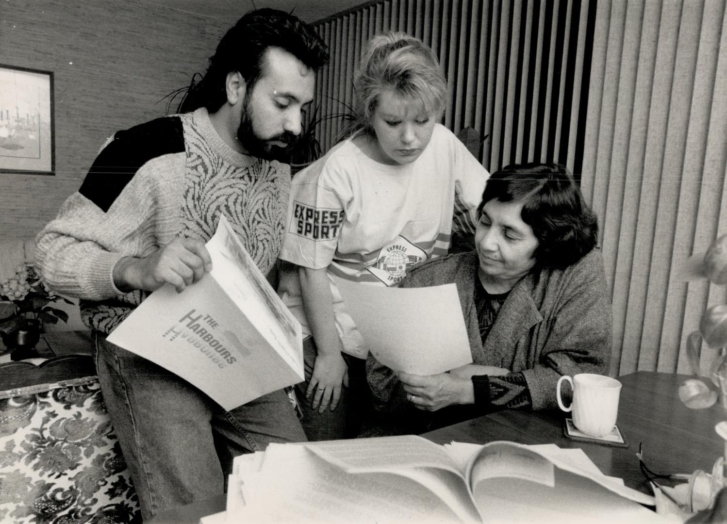 Frozen out: David Myers, his wife Carolyn, and his mother Gladys, seated, inspect condo purchase documents cancelled after the Harbourfront development freeze