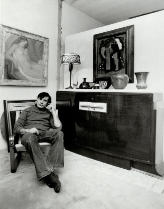 Affordalb etreasure: Robert Navaroo, below left, relaxes in front of painting of nude by unknown Russian artist.