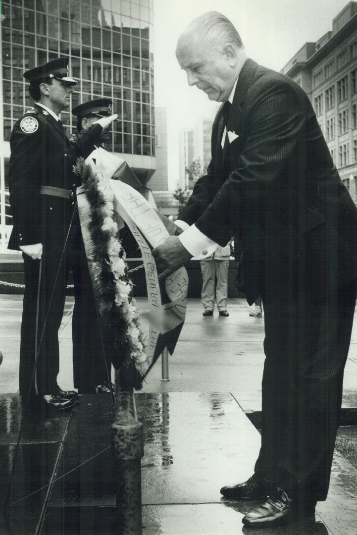 Lest we forget: Jerzy Palasz, Poland's consul-general, lays a wreath at Toronto City Hall cenotaph to mark the 50th anniversary of the start of World War II