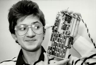 Top of the class: Jan Noworoiska, who placed first in the senior applied science and engineering category at the Metro Science Fair, shows off his computerized aid for the visually impaired