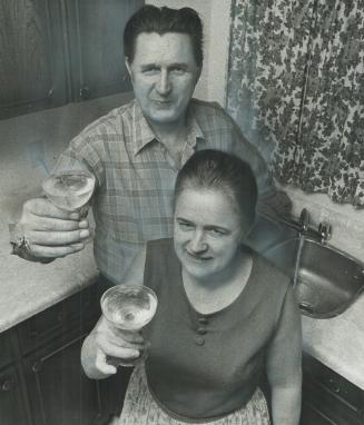 The first glasses of water to actually come out of the water tap in their new home on Macauley Ave