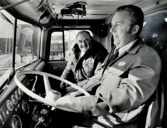 Erv O'Brien sets out for run to Hamilton with a load of sodium silicate in his tanker and reporter Jack Cahill (left) along for ride