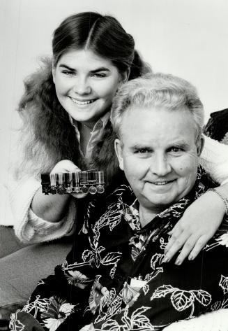 Miniature medals: Gerald osborn and his daughter Dawn, 18, with replicas of her grandfather's medals, including the Victoria Cross.