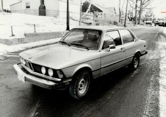 Storm centre: Hydro commissioner William Peden drives his $15,000 BMW 3201 downtown this morning after City Council members criticized the deal under which he sold it to Toronto Hydro and got the use of it