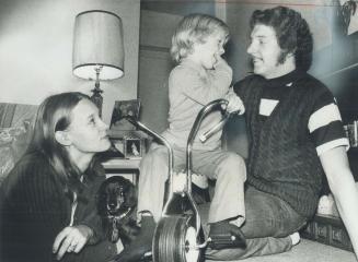 A Grateful Stephen Prevost plays with his son, Stephen, 3, on a bike given to him by an anonymous woman