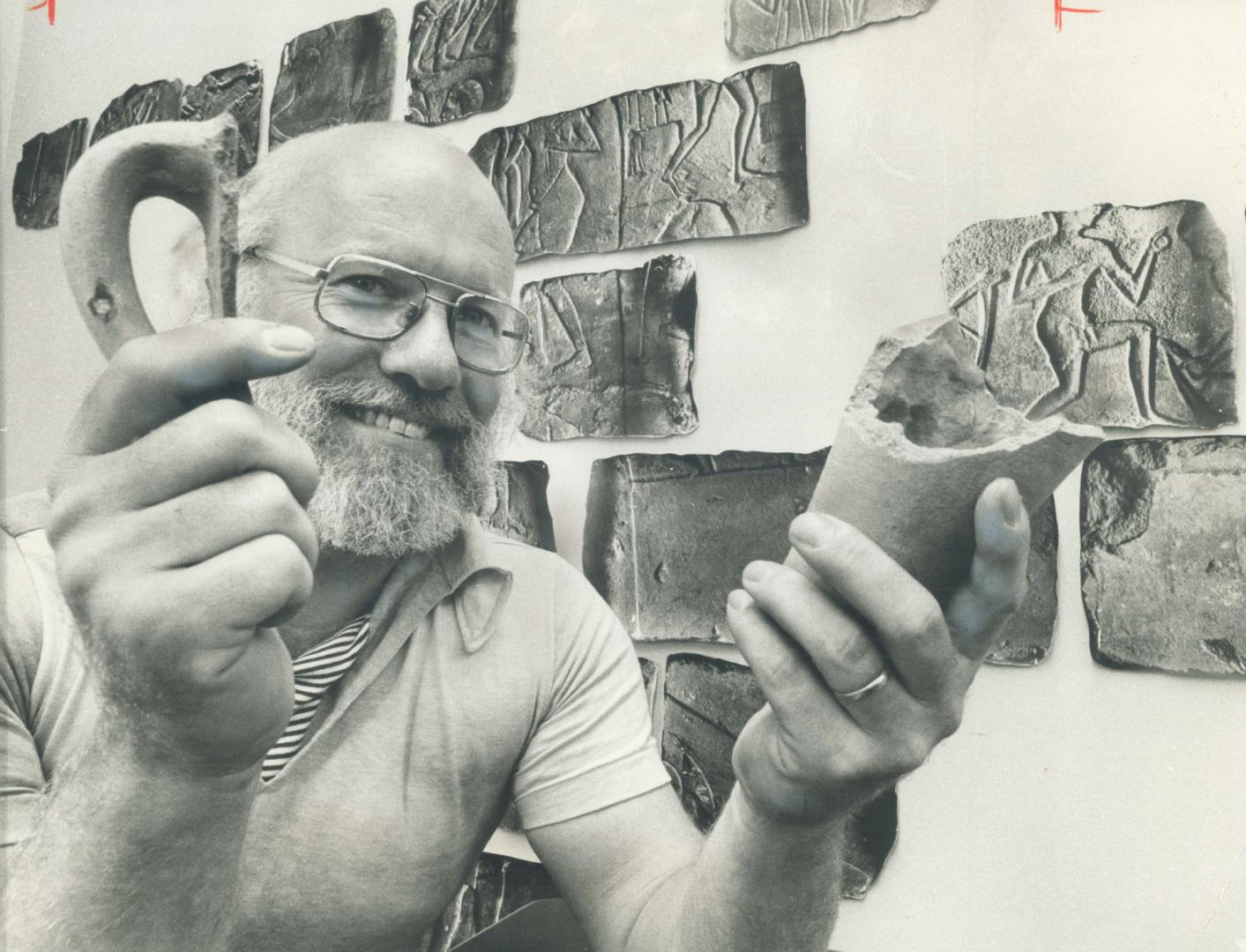 University of Toronto's Don Redford displays fragments of a large wine vessel from 14th- century-BC Egypt