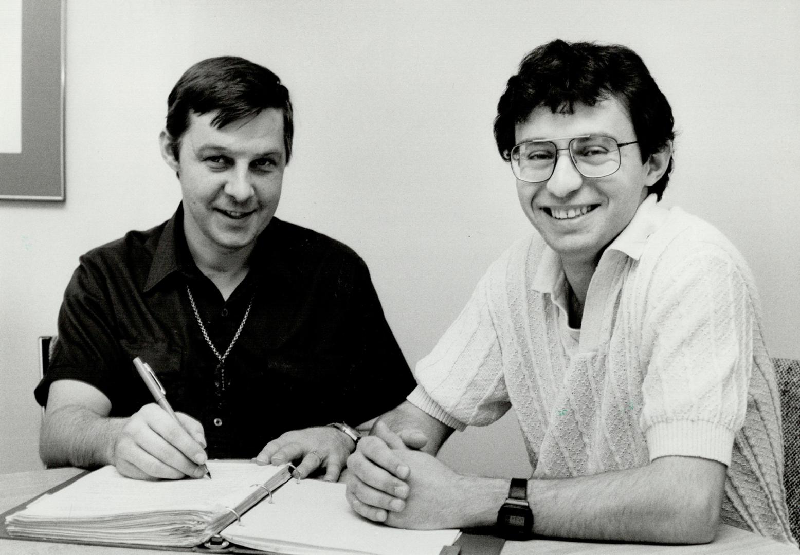 Selfless volunteer: Student Bijan Rafii, right, formed a group at Erindale College to help others and here coaches Peter Milne to improve his reading and writing skills