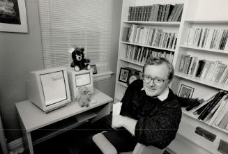 Austere privacy: Robert Ramsay is kept company in his small downtown den by two computers and a pile of books, all read.