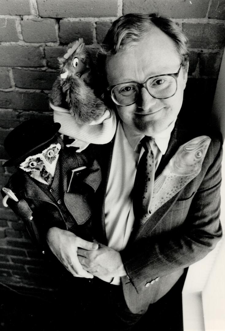 Animal assortment: Robert Ramsay poses with an array of novel gifts for men including a chicken hat, fish tie and businessman's stuffed owl offered at the National Ballet School's Sugar Plum Fair Nov