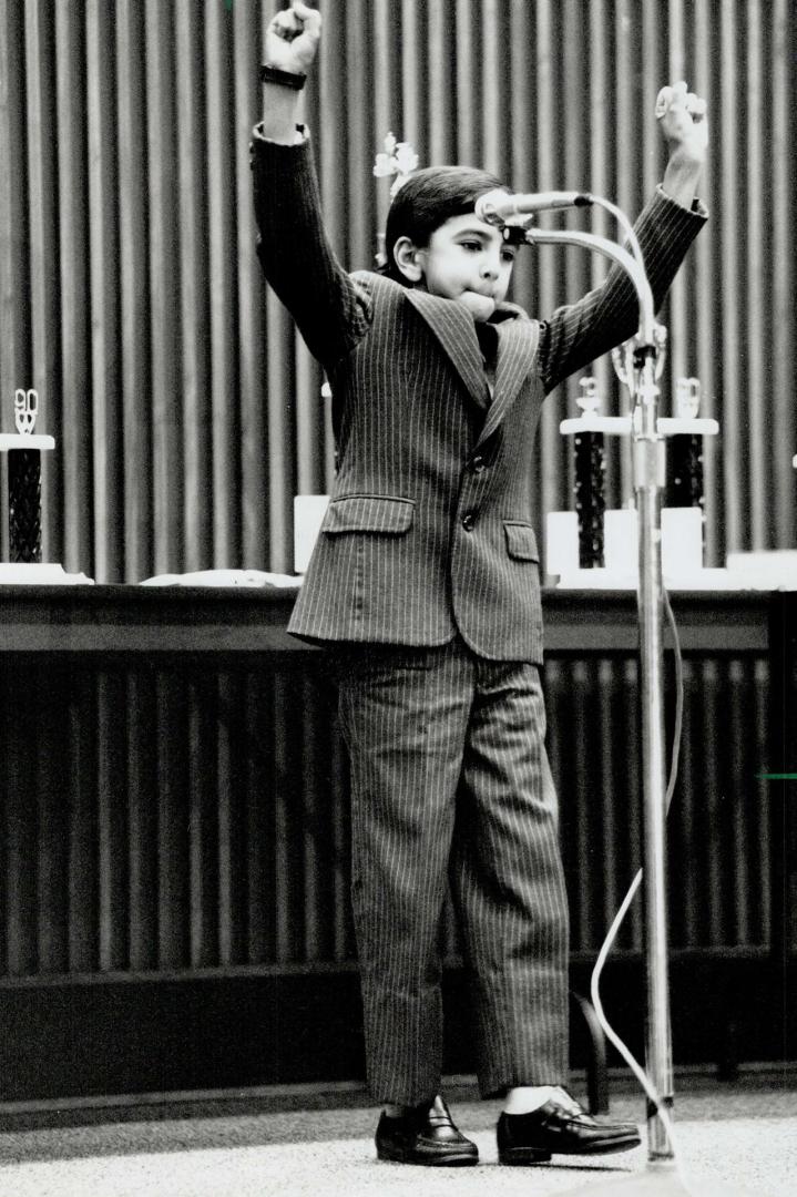 Aced them: Ali Ratanshi, 9, of Scarborough pumps his fists in victory after winning a trip to Jamaica yesterday in the Spelling Bee of Canada Contest at Queen's Park