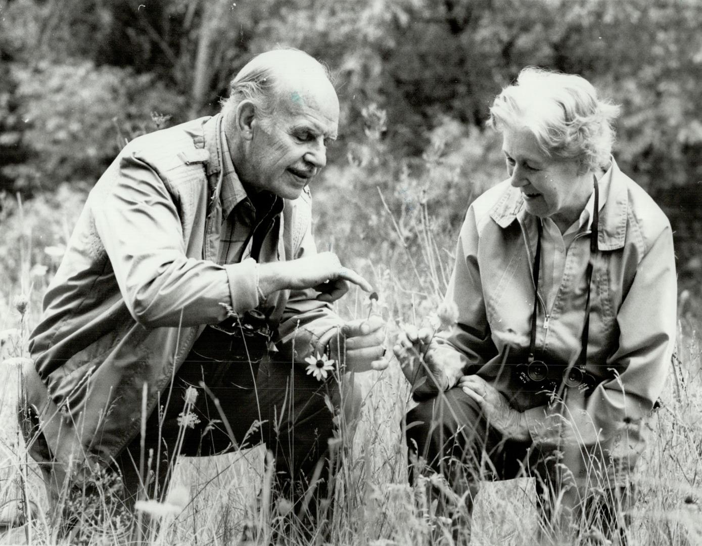 Avid naturalists: Bill and Eva Rich of Don Mills, both members of the Federation of Ontario Naturalists, enjoy studying wildflowers and bird-watching