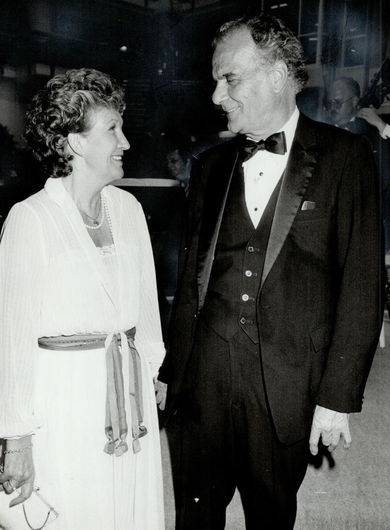 Keith Roberts, Olympia and York senior vice-president of design and development, above, celebrates with his wife, Patience.