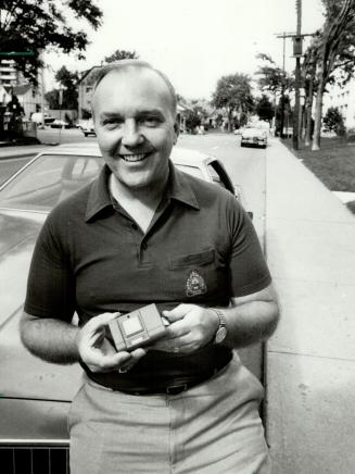 Hamilton Inventor: Policeman Dave Robertson shows device he says will stop drivers from speeding away.